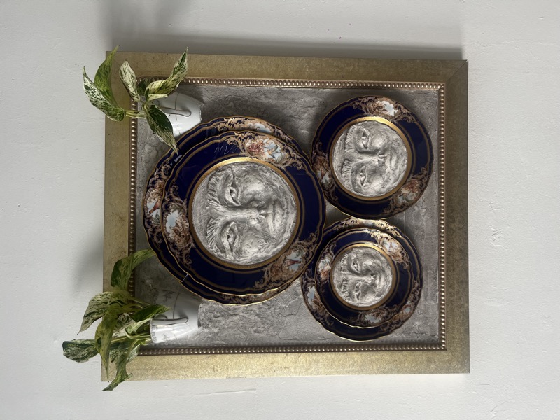 Phases — three moon faces set into cobalt and gold vintage plates